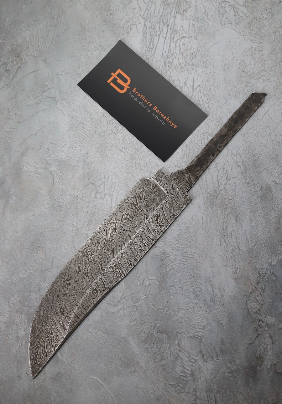 Hand-forged Damascus steel blade made from U8A, ShKh-15, 5KhNMA, and 45 steel – 85 mm length, etched finish Hand-forged Damascus steel blade made from U8A, ShKh-15, 5KhNMA, and 45 steel – 85 mm length, etched finish
